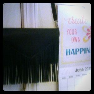 Black crossbody purse with fringe